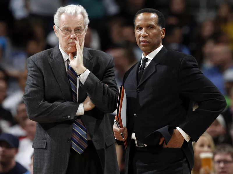 Denver Nuggets assistant coaches Doug Moe and Adrian Dantley confer