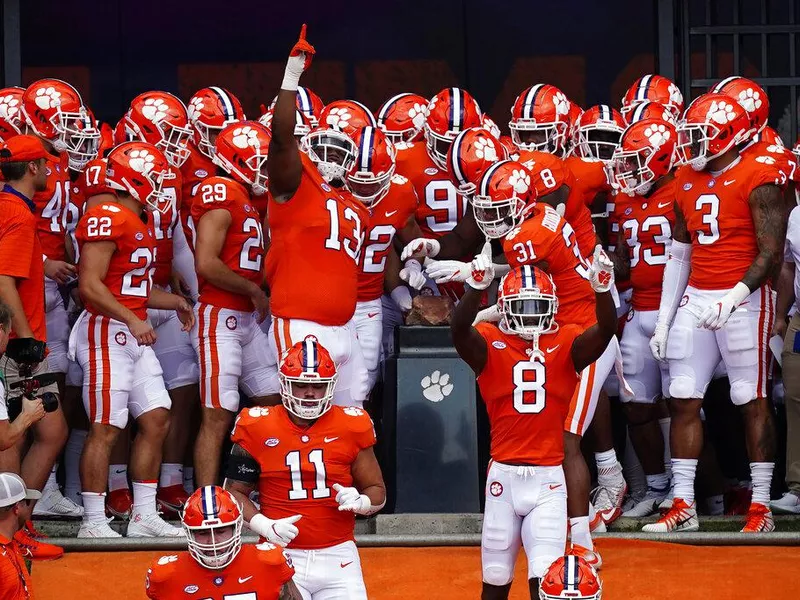 Clemson players touch Howard's Rock