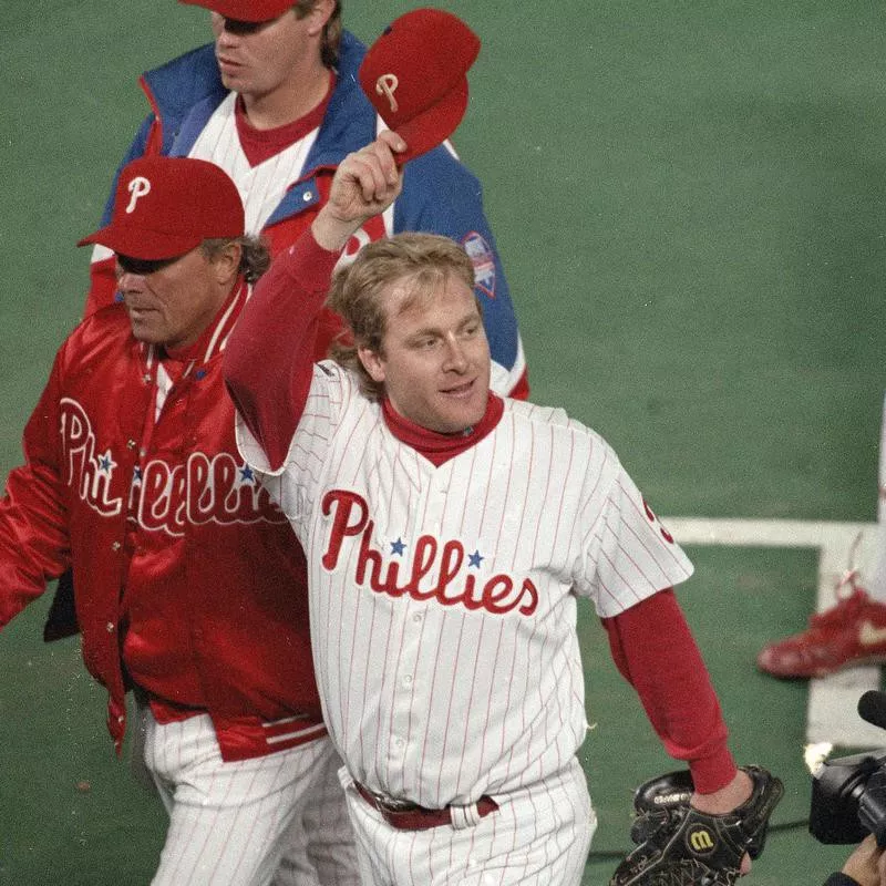 Philadelphia Phillies pitcher Curt Schilling tips his hat