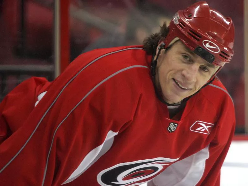 Rod Brind'Amour smiles during team practice