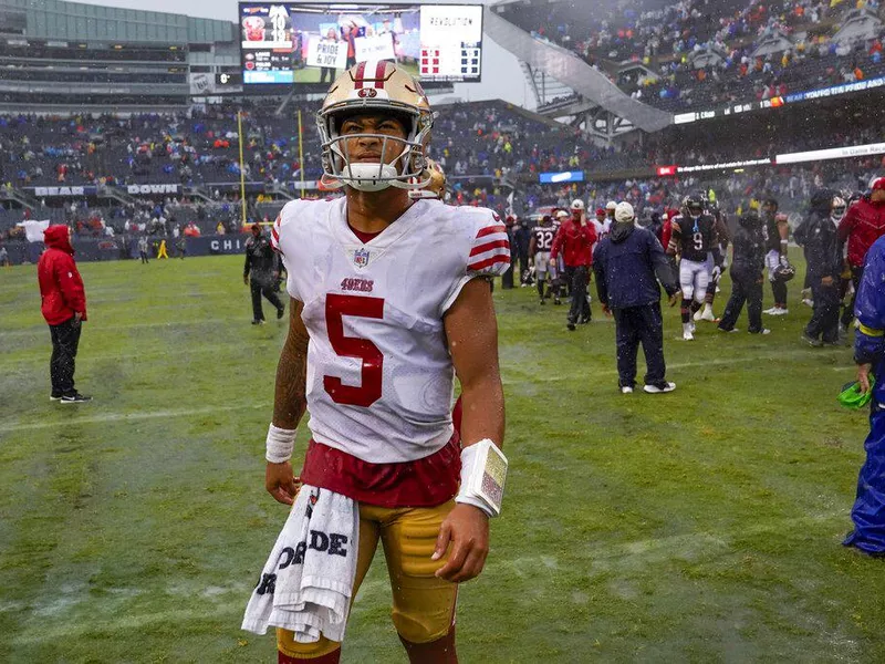 San Francisco 49ers quarterback Trey Lance walking off field