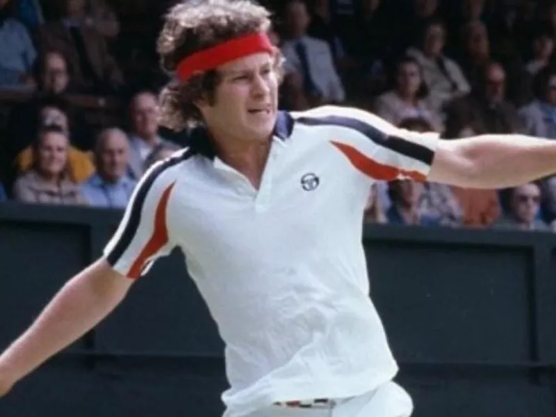 John McEnroe wearing headband