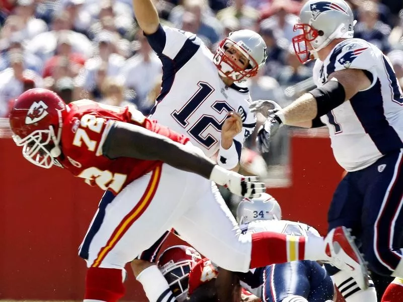 Tom Brady is hit by Bernard Pollard