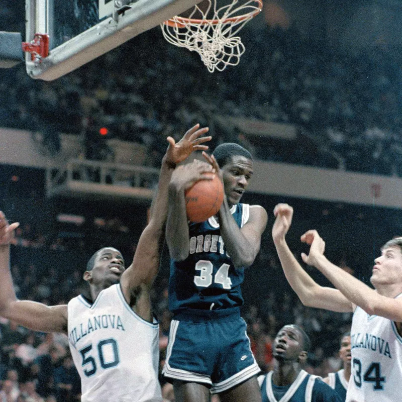 Georgetown's Reggie Williams hugs his rebound