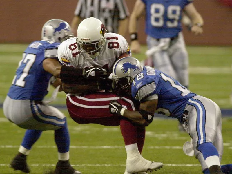 Arizona Cardinals' Anquan Boldin stopped by Detroit Lions' Eddie Drummond