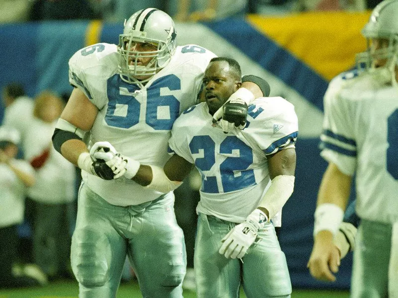 Dallas Cowboys teammates Kevin Gogan, left, and Emmitt Smith