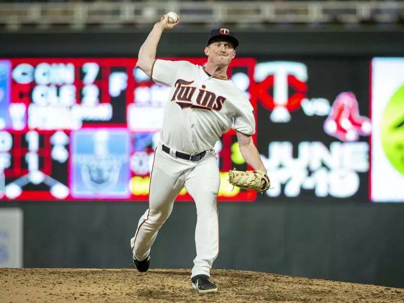 Minnesota Twins relief pitcher Ryan Eades throws to Seattle Mariners