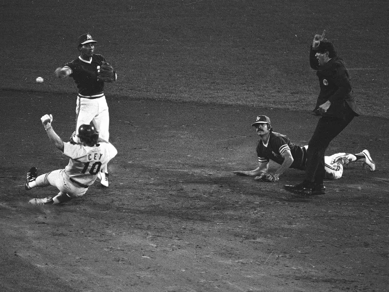 Oakland A's shortstop Bert Campaneris fires to first