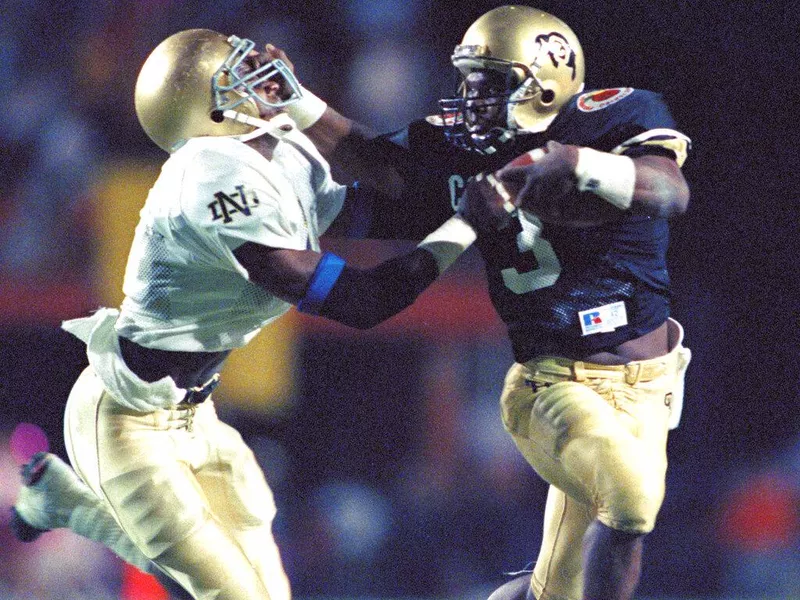 Colorado quarterback Darian Hagan and Notre Dame safety Todd Lyght