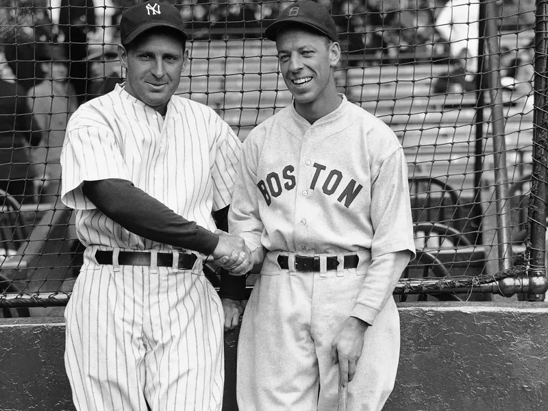 Ben Chapman, left, shaking his hands with Bill Werber