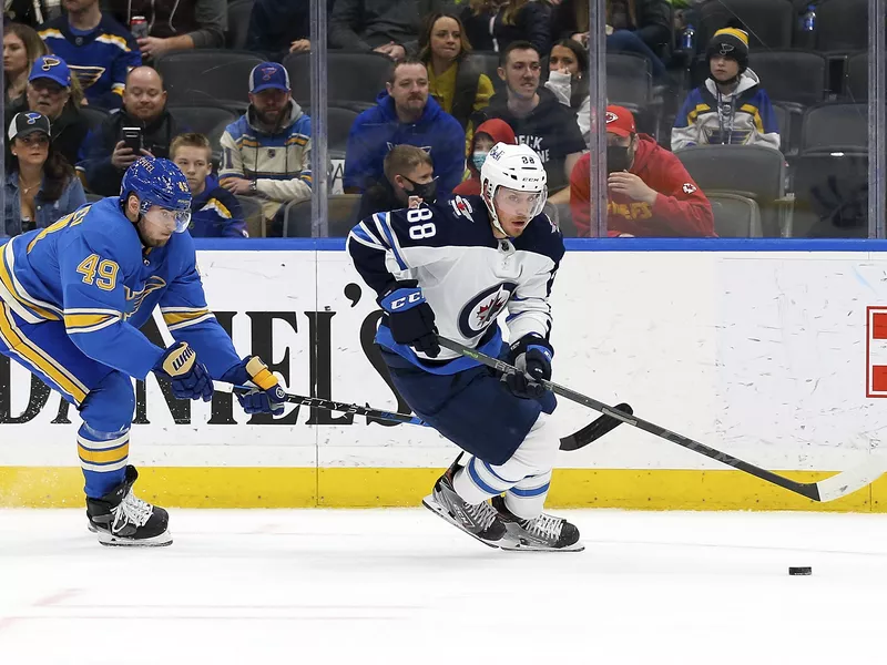 Winnipeg Jets' Nate Schmidt controls the puck