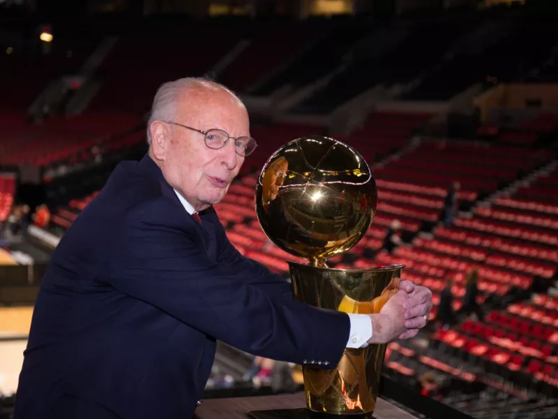 Bill Schonely with trophy