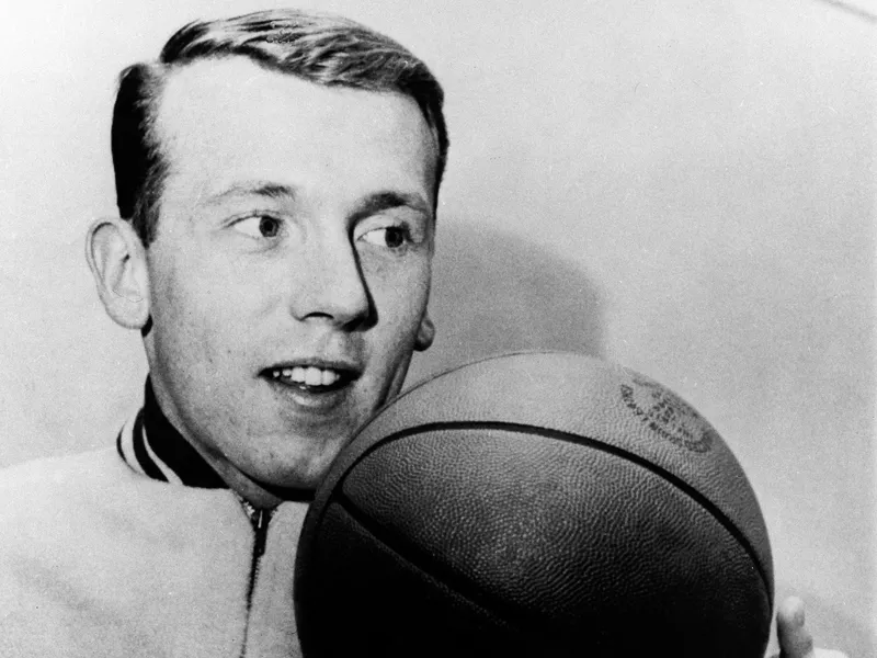 Billy Cunningham twirls a basketball