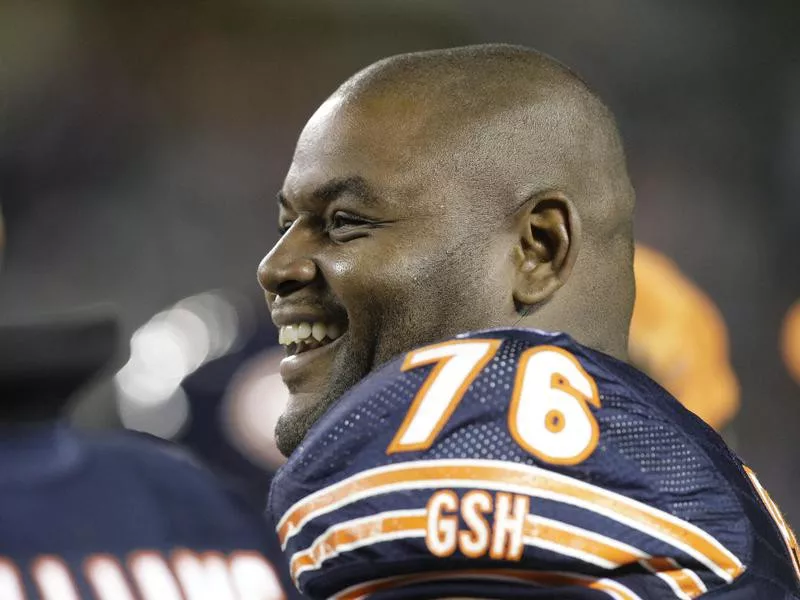 Orlando Pace smiling on the sidelines