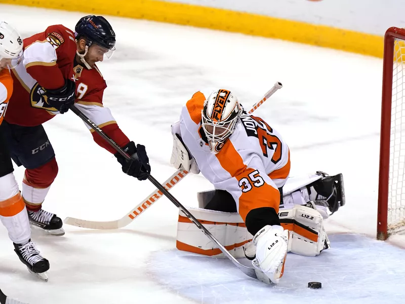 Philadelphia Flyers goaltender Martin Jones stops shot