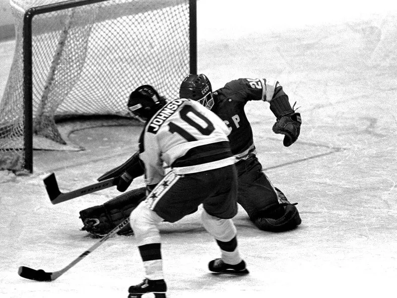 Mark Johnson shoots the puck