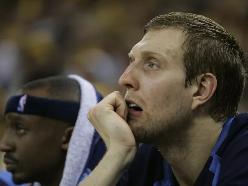 Dallas Mavericks' Dirk Nowitzki and teammate Jason Terry look on