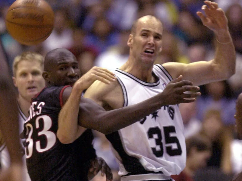 San Antonio Spur Danny Ferry tangled up with Philadelphia 76er Jumaine Jones