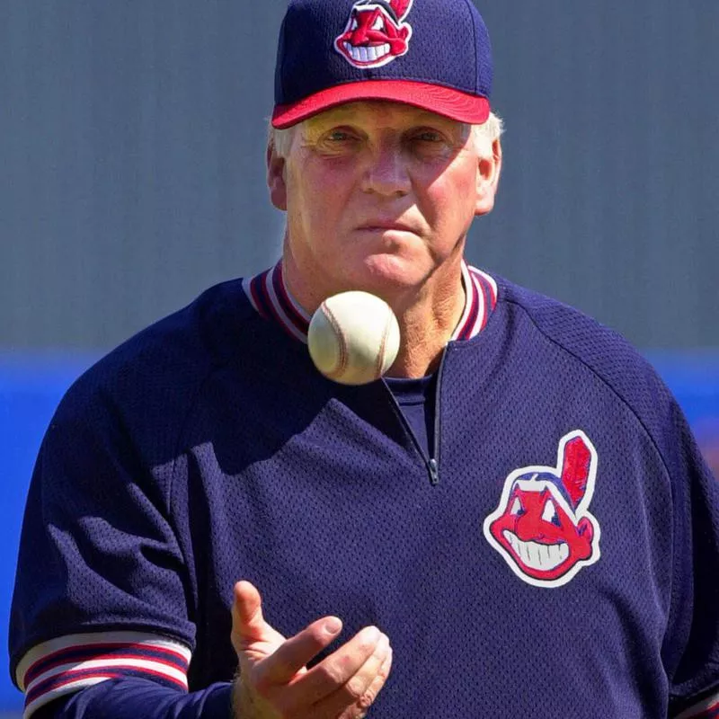 Charlie Manuel flips a ball