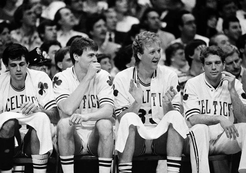 Boston Celtics' Larry Bird cheers on team from bench