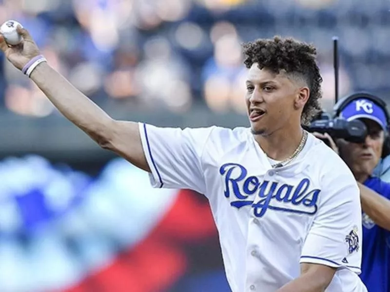 Patrick Mahomes throws at the first pitch at a Royals game