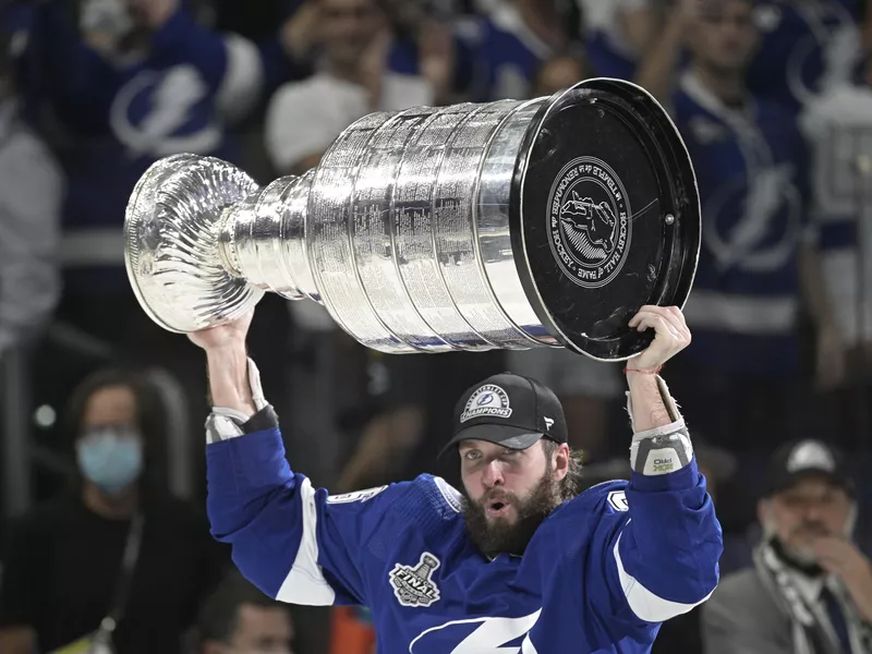 Nikita Kucherov hoists the Stanley Cup