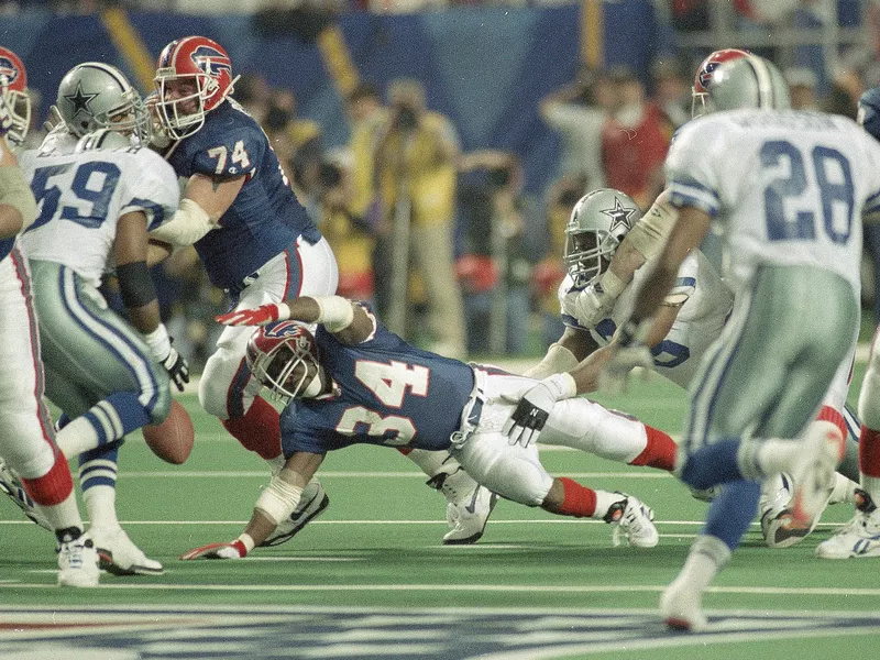 Buffalo Bills running back Thurman Thomas fumbles the ball