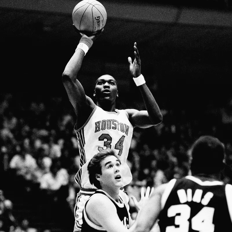 Akeem Olajuwon jumps with shot over Maryland's Mark Fothergill