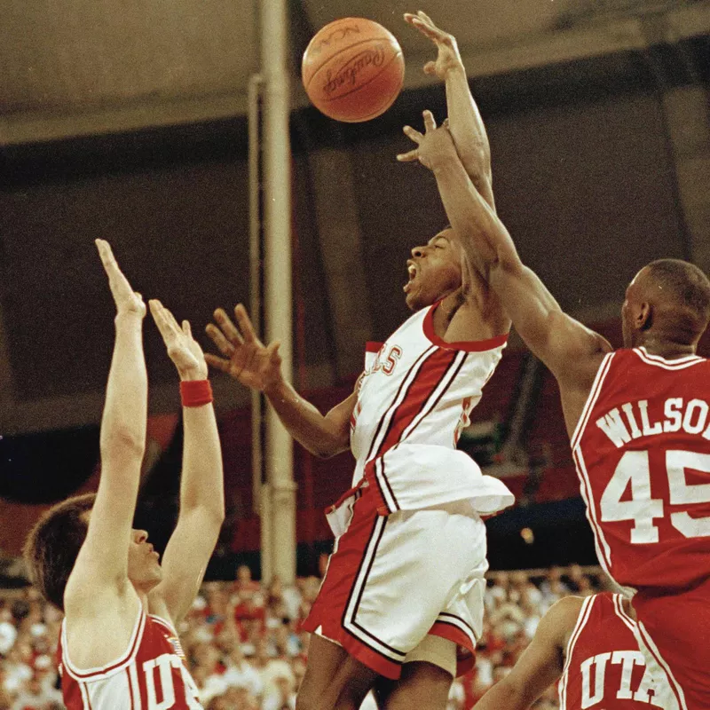 UNLV's Greg Anthony goes to basket between Utah's Josh Grant and Byron Wilson