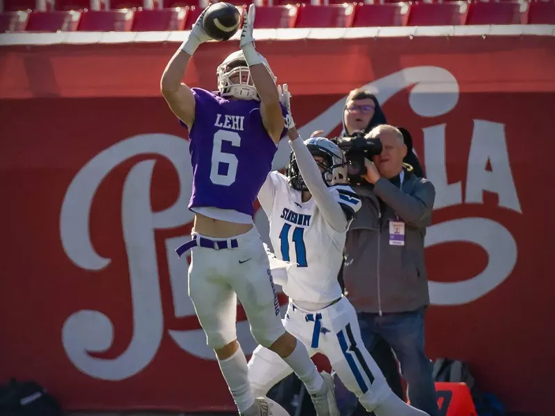 Lehi High football player makes play on the ball