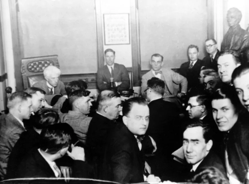 Judge Kenesaw Mountain Landis, rear left, talks Chicago White Sox players in 1921