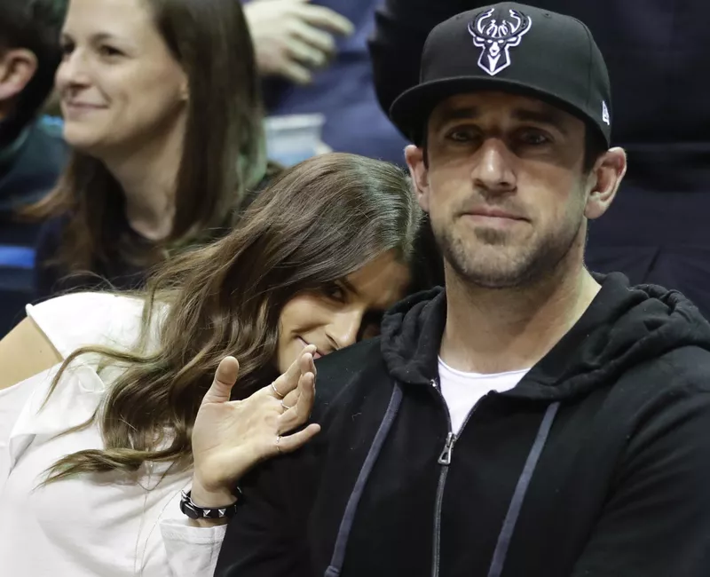 Aaron Rodgers watching Milwaukee Bucks