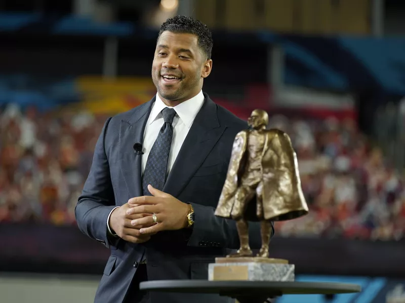 Russell Wilson winning Walter Payton NFL Man of the Year awards