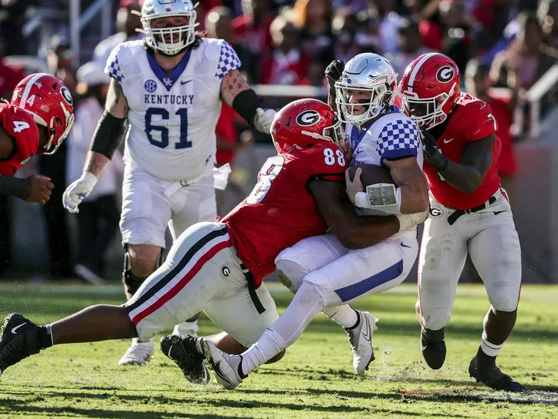 Georgia defensive lineman Jalen Carter sacks Kentucky quarterback Will Levis