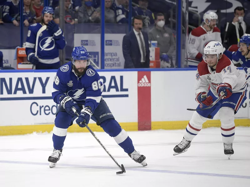 Nikita Kucherov controls a puck