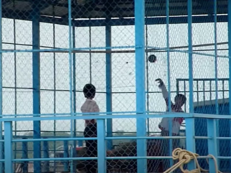 Kids playing basketball at a floating village in Cambodia