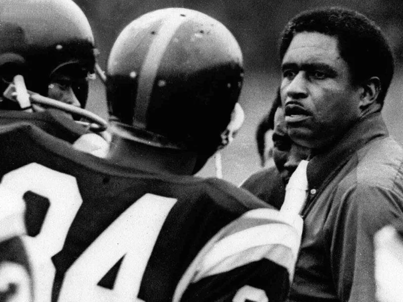 Grambling State head coach Eddie Robinson talks to players