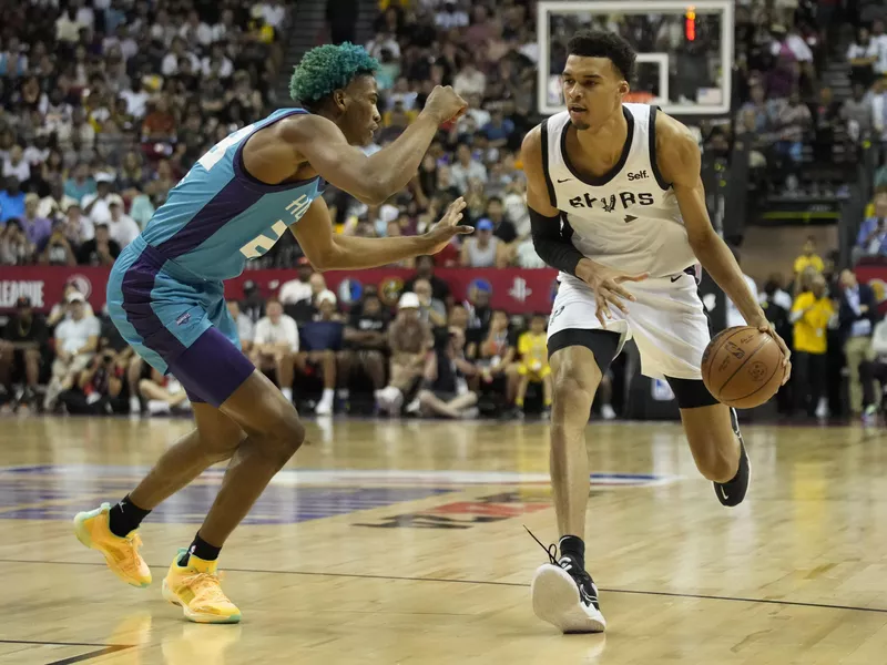 Victor Wembanyama dribbles during an NBA summer league game