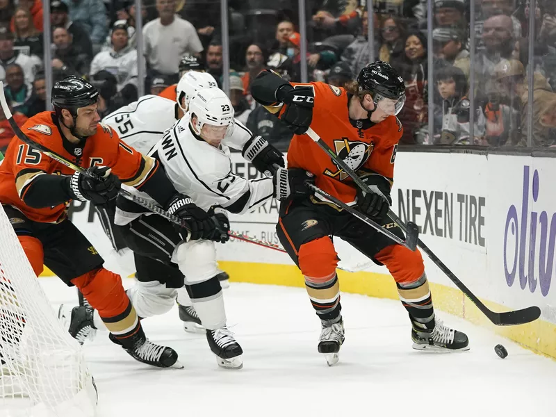 Los Angeles Kings' Dustin Brown fights for puck