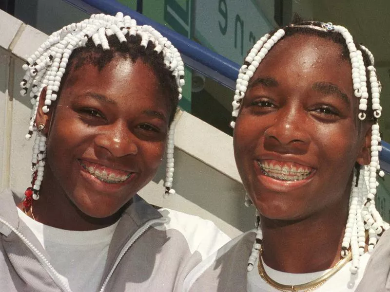 Venus Williams and Serena Williams pose