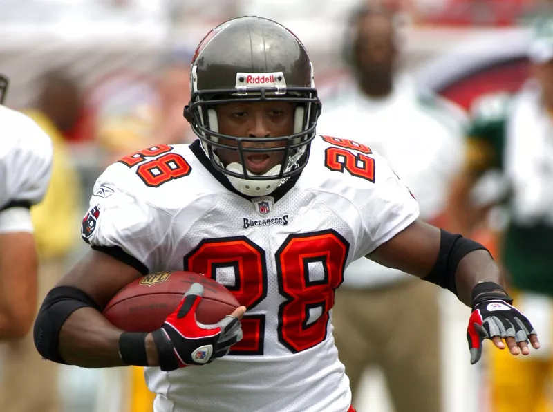 Tampa Bay Buccaneers running back Warrick Dunn runs for first down