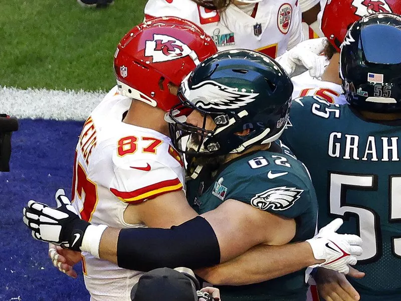 Kansas City Chiefs tight end Travis Kelce (87) embraces his brother Philadelphia Eagles center Jason Kelce