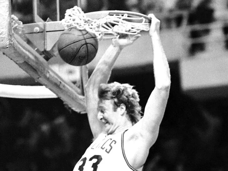 Boston Celtics forward Larry Bird dunks