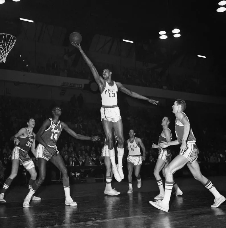 Wilt Chamberlain goes up for basket