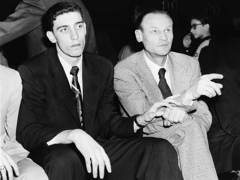 New York Knicks coach Joe Lapchick interacts with Clarence 