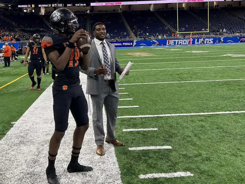 Belleville quarterback Bryce Underwood and interim head coach Dejuan Rogers