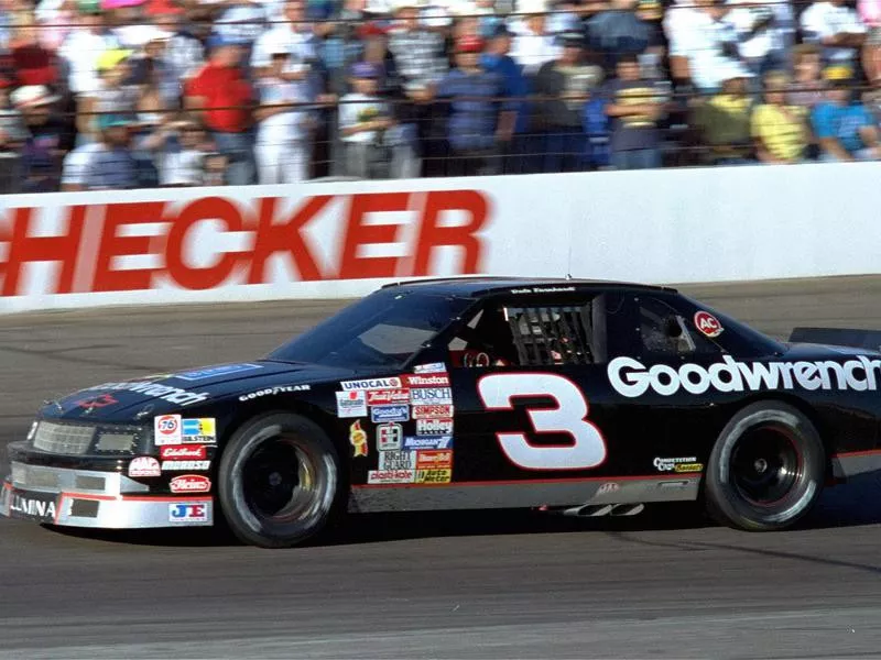 Dale Earnhardt zips by race fans