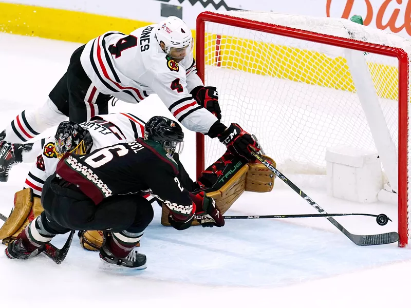 Chicago Blackhawks defenseman Seth Jones (4) makes save on shot by Arizona Coyotes left wing Antoine Roussel