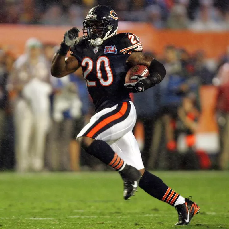 Chicago Bears running back Thomas Jones gains some yardage