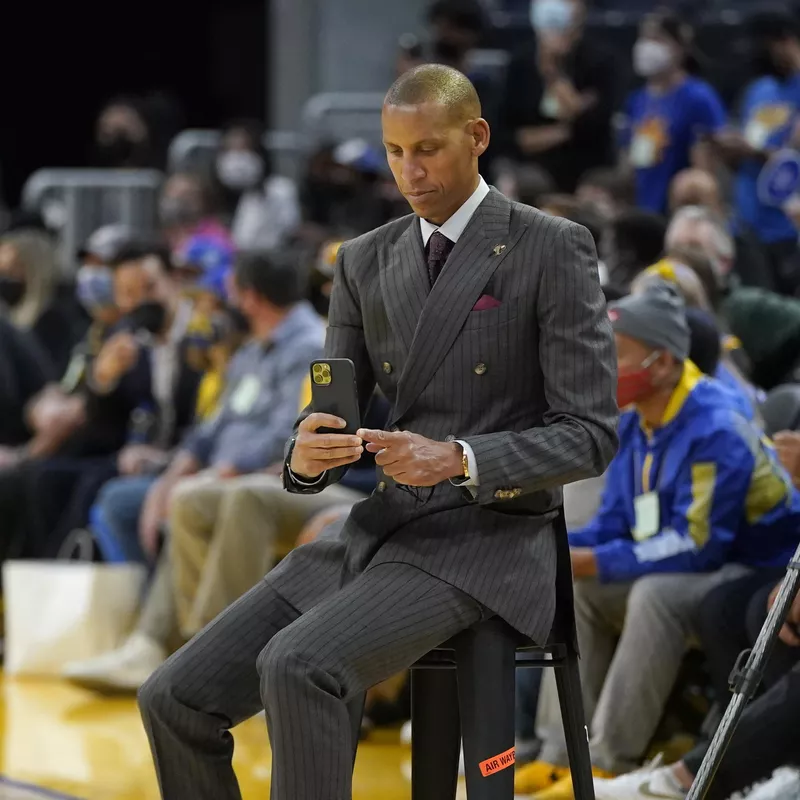 Reggie Miller sitting before game